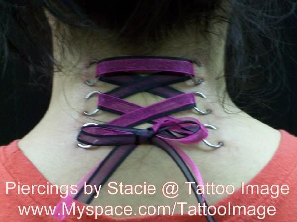 ok well i got the back of my neck pierced like a corset ill show a pic but 